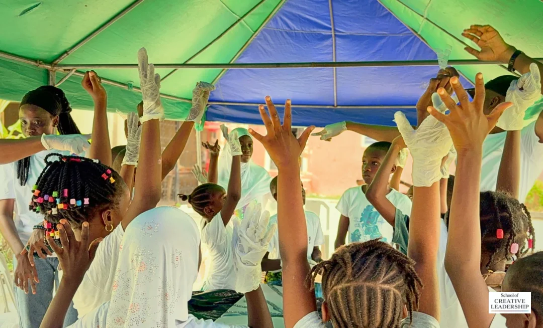 Participants raising their hands during the project
