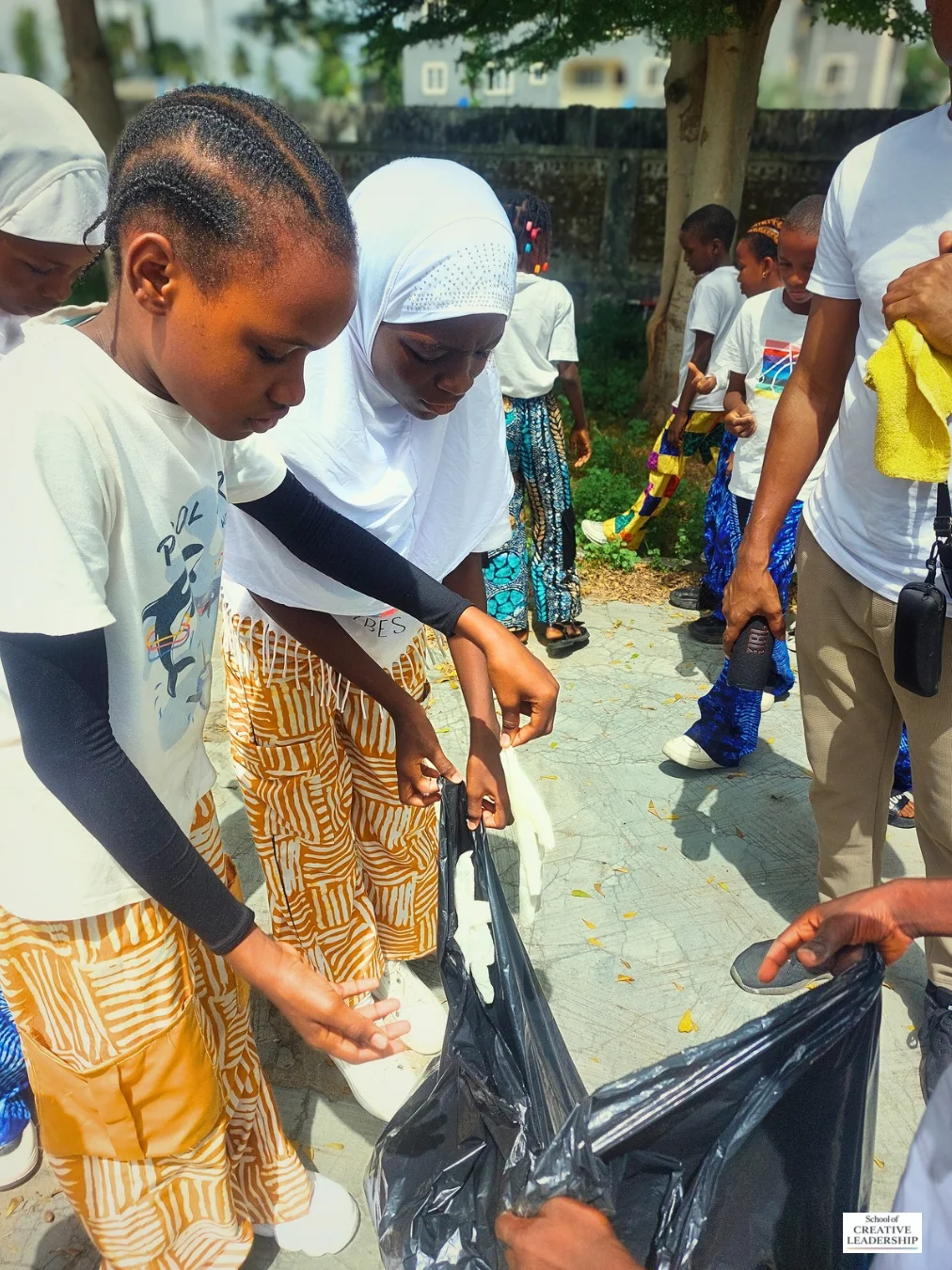 Children collecting plastic waste