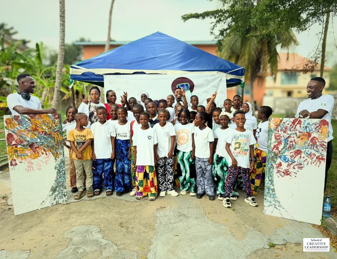 Rebirth Canvas participants gathered with their completed artwork