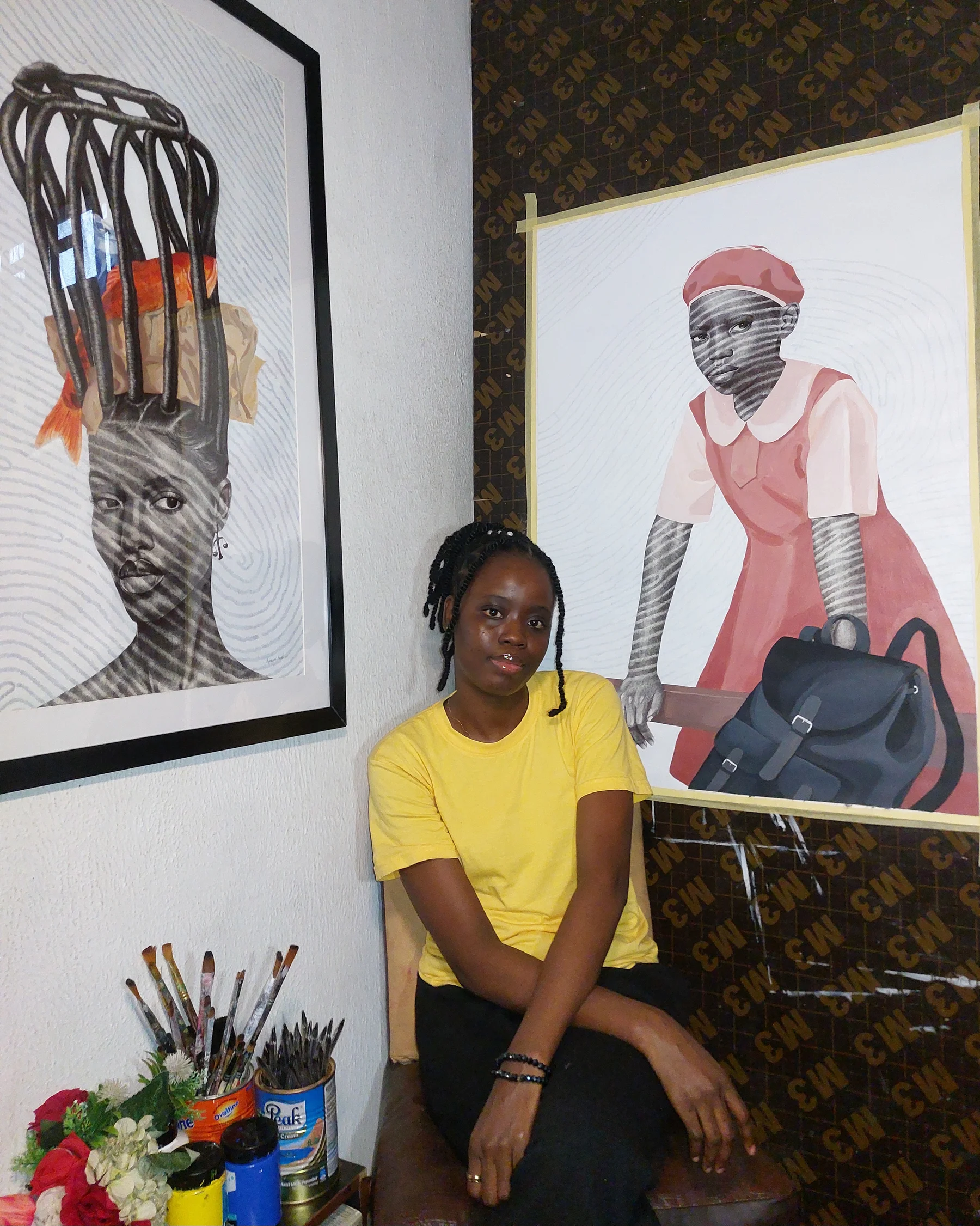 Rasaki Rukayat Ayokunmi in the studio with their work